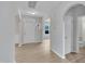Bright foyer with neutral walls, light wood floors, and an archway at 5025 Stonewood Pines Dr, Knightdale, NC 27545