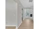 Hallway featuring light wood floors and an archway leading to other rooms at 5025 Stonewood Pines Dr, Knightdale, NC 27545