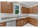 Beautiful kitchen features wood cabinets, stainless steel appliances, and granite countertops at 5025 Stonewood Pines Dr, Knightdale, NC 27545