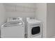 Convenient laundry area with modern LG washer and dryer set, plus overhead shelving at 5025 Stonewood Pines Dr, Knightdale, NC 27545