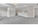 Upstairs living space featuring soft carpeting, neutral paint, and natural light at 5025 Stonewood Pines Dr, Knightdale, NC 27545
