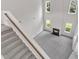 Open floor plan features a fireplace, lots of windows, and gray carpet at 5025 Stonewood Pines Dr, Knightdale, NC 27545