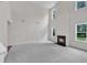 Bright living room with a fireplace and large windows at 5025 Stonewood Pines Dr, Knightdale, NC 27545