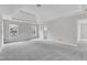 Bright main bedroom with carpeting, natural light, and ensuite bathroom at 5025 Stonewood Pines Dr, Knightdale, NC 27545