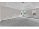 Large main bedroom features tray ceilings, natural light, and soft carpeting at 5025 Stonewood Pines Dr, Knightdale, NC 27545