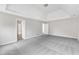 Large main bedroom features tray ceilings, natural light, and ensuite bathroom at 5025 Stonewood Pines Dr, Knightdale, NC 27545