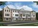 A row of new construction townhomes with varied exterior finishes and crisp white-framed windows at 5029 Jowetts Walk Dr # 29, Cary, NC 27519