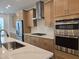 Modern kitchen features stainless appliances, light cabinets, and white countertops at 5029 Jowetts Walk Dr # 29, Cary, NC 27519