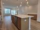 Kitchen island features a sink, stainless steel dishwasher and room for seating at 5029 Jowetts Walk Dr # 29, Cary, NC 27519