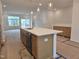 Kitchen island with sink, dishwasher, pendant lighting and lots of room for seating at 5029 Jowetts Walk Dr # 29, Cary, NC 27519