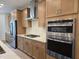 Well-lit kitchen with stainless steel appliances, light wood cabinets, and white countertops at 5029 Jowetts Walk Dr # 29, Cary, NC 27519