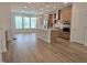 Open concept kitchen features an island, stainless appliances and light wood cabinets at 5029 Jowetts Walk Dr # 29, Cary, NC 27519