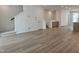 Spacious living area showcasing modern finishes and an open floor plan with a staircase at 5029 Jowetts Walk Dr # 29, Cary, NC 27519
