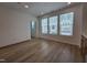 Bright, open living room featuring wood flooring and large windows providing natural light at 5029 Jowetts Walk Dr # 29, Cary, NC 27519