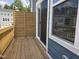 Cozy private outdoor patio with wooden privacy screen and wooden flooring at 5029 Jowetts Walk Dr # 29, Cary, NC 27519