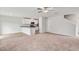 Open-concept space with carpet, LVP flooring, white walls, recessed lighting, and a ceiling fan at 51 Crow Field St, Roxboro, NC 27574