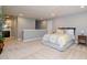 Bright bedroom with neutral walls, plush carpet, and a decorative bed with floral patterns and soft lighting at 522 Finnbar Dr, Cary, NC 27519