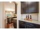 Stylish kitchen featuring granite counters, dark cabinets, and stainless steel appliances at 522 Finnbar Dr, Cary, NC 27519