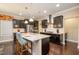 Gourmet kitchen with stainless steel appliances, granite counters, and a central island with seating at 522 Finnbar Dr, Cary, NC 27519