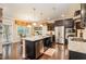 Spacious kitchen featuring a large island, stainless appliances, and dark wood cabinets at 522 Finnbar Dr, Cary, NC 27519