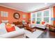 Bright living room featuring hardwood floors, fresh paint, large windows, and stylishly coordinated furniture at 522 Finnbar Dr, Cary, NC 27519