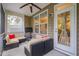 Cozy screened porch with comfortable seating, a ceiling fan, and a view of the backyard and adjacent properties at 522 Finnbar Dr, Cary, NC 27519