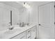 Well-lit bathroom showcasing a double sink vanity with a large mirror and modern fixtures for everyday convenience at 604 Salmonberry Dr, Holly Springs, NC 27540
