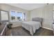 Serene bedroom with a tufted headboard, light walls, and an area rug, creating a relaxing retreat at 604 Salmonberry Dr, Holly Springs, NC 27540