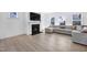 Cozy living room featuring a fireplace, plush sofa, and ample natural light, creating an inviting space at 604 Salmonberry Dr, Holly Springs, NC 27540