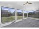 View of the backyard from the screened in porch with ceiling fan, offering the perfect blend of indoor/outdoor living at 604 Salmonberry Dr, Holly Springs, NC 27540