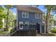 Charming backyard with a deck, stairs, and blue siding on the house at 6717 Ebon Ct, Raleigh, NC 27615
