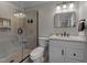 Modern bathroom with glass shower, granite vanity top and tile flooring at 6717 Ebon Ct, Raleigh, NC 27615