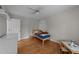 Cozy bedroom with wood floors and a unique tiger stuffed animal on the bed at 6717 Ebon Ct, Raleigh, NC 27615