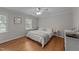 Comfortable bedroom with wood floors, a ceiling fan and plenty of natural light at 6717 Ebon Ct, Raleigh, NC 27615