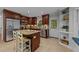 Beautiful kitchen featuring an island with granite countertops, stainless steel appliances, and ample cabinet space at 6717 Ebon Ct, Raleigh, NC 27615