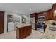 Well-equipped kitchen with stainless steel appliances, granite countertops, and convenient access to laundry area at 6717 Ebon Ct, Raleigh, NC 27615