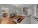 Bright living room with hardwood floors, fireplace, an abundance of natural light, and neutral paint at 6717 Ebon Ct, Raleigh, NC 27615