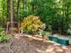Secluded backyard retreat featuring a cozy swing and raised garden bed at 676 Whitehurst, Pittsboro, NC 27312