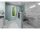 Beautiful bathroom features a glass walk-in shower with marble tile, and a large window at 676 Whitehurst, Pittsboro, NC 27312