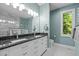 Spacious bathroom boasts a double sink vanity, walk-in shower with marble, and a private toilet area at 676 Whitehurst, Pittsboro, NC 27312