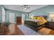 Relaxing bedroom with hardwood floors, a ceiling fan and ensuite access at 676 Whitehurst, Pittsboro, NC 27312