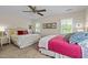 Bright bedroom with twin beds, comfortable bedding, and natural light from the windows at 676 Whitehurst, Pittsboro, NC 27312