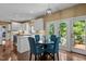 Bright eat-in kitchen area with table, chairs, and a view of the backyard at 676 Whitehurst, Pittsboro, NC 27312