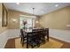 Dining room featuring a chandelier, large table with seating for eight and hardwood floors at 676 Whitehurst, Pittsboro, NC 27312