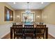 Dining room featuring a chandelier, large table with seating for eight and hardwood floors at 676 Whitehurst, Pittsboro, NC 27312