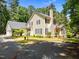 Traditional home with a well-maintained yard, showcasing its classic architecture at 676 Whitehurst, Pittsboro, NC 27312