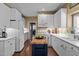 Kitchen with white cabinetry, stainless appliances, and an island with butcher block countertop at 676 Whitehurst, Pittsboro, NC 27312