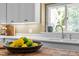 A bowl of lemons and limes sit on a wood-topped kitchen island in a bright kitchen at 676 Whitehurst, Pittsboro, NC 27312