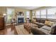Open concept living room featuring fireplace, plush sectional sofa, and hardwood floors at 676 Whitehurst, Pittsboro, NC 27312