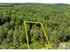 Aerial view of a wooded property showing the boundaries, highlighting the size and privacy at 676 Whitehurst, Pittsboro, NC 27312